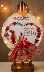 INFINITY CREATIONS Customized Wedding Embroidery Hoop Frame | Handcrafted Hoop with Floral Design, Pearl Border & Calendar Display | Personalized Couple Names | Marriage, Anniversary Gifts | Red and Pink Theme Keepsake Gift (10 Inch)