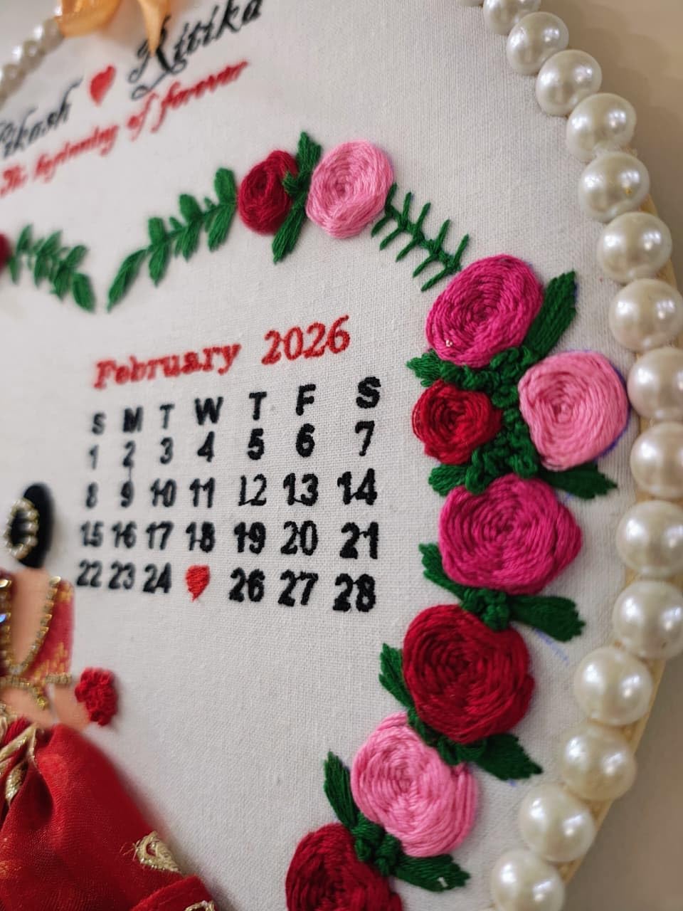 INFINITY CREATIONS Customized Wedding Embroidery Hoop Frame | Handcrafted Hoop with Floral Design, Pearl Border & Calendar Display | Personalized Couple Names | Marriage, Anniversary Gifts | Red and Pink Theme Keepsake Gift (10 Inch)
